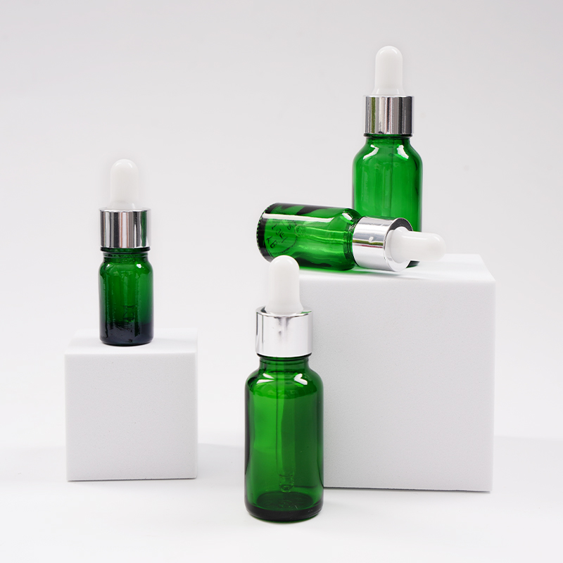 Green glass essential oil bottle
