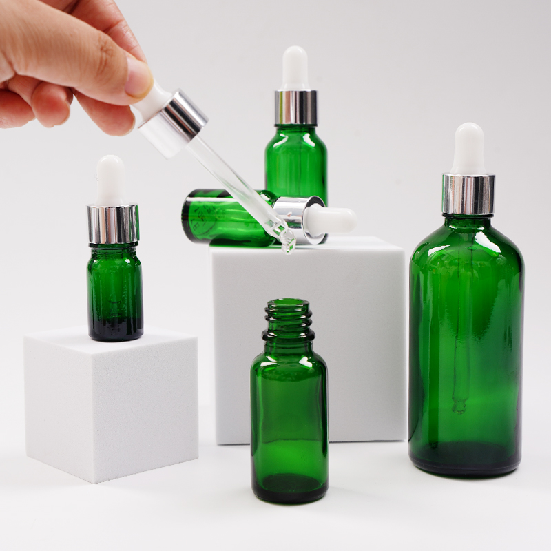 Green glass essential oil bottle