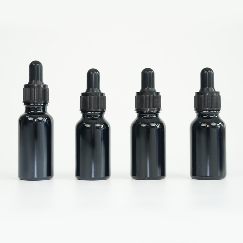Black glass essential oil bottle